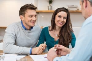 Young couple meeting with lender