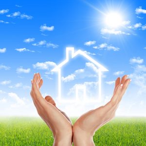 Hands holding white outline of a house - graphic