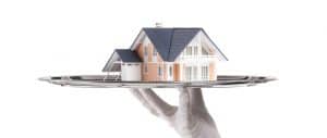 Butler holding a house on a platter