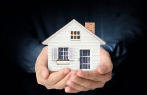 Hand holding a home